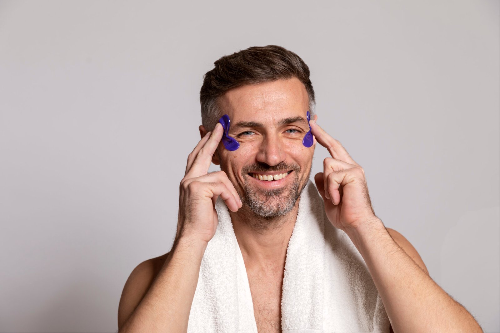 man-using-anti-aging-treatment